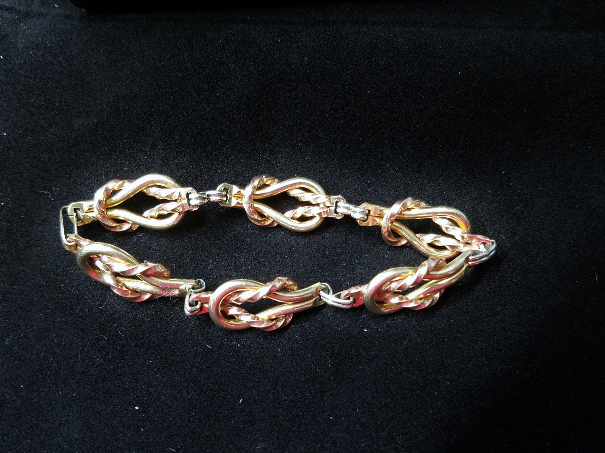 Chestnut brown string bracelet, three plates, Greek key, flowers